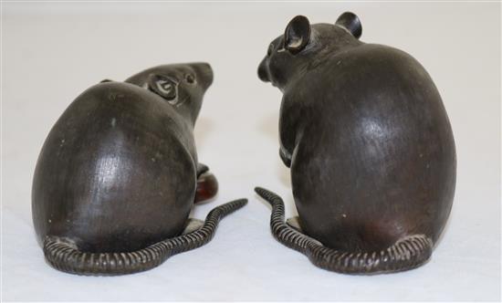 Two Japanese two-colour bronze models of a rat holding a nut, 19th century, length 9cm and 9.5cm